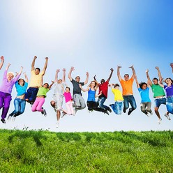 Large group of people jumping against the clear sky. 