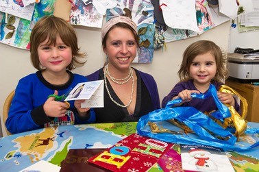 Suzanne and children making labels